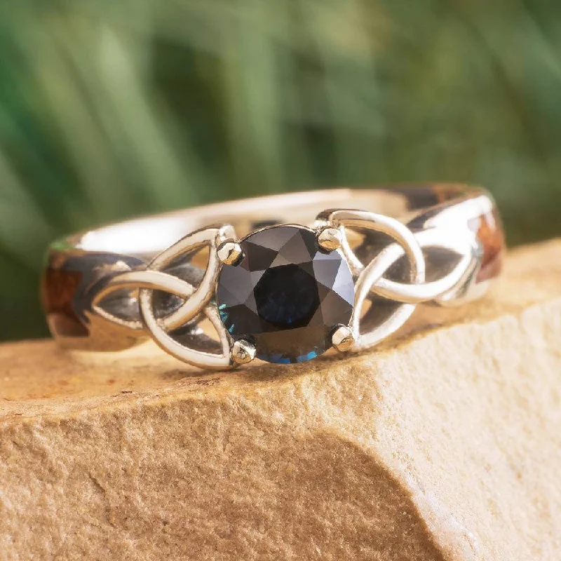 Wooden Celtic Engagement Ring with Trinity Knots and Dark Blue Sapphire