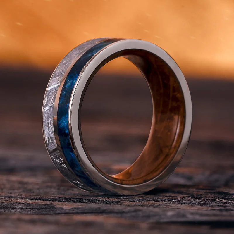 Meteorite, Blue Box Elder Burl, And Titanium Ring With Whiskey Wood Sleeve