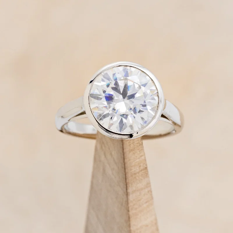 "EDITH" - SOLITAIRE BEZEL SET MOISSANITE ENGAGEMENT RING WITH DIAMOND ACCENTS