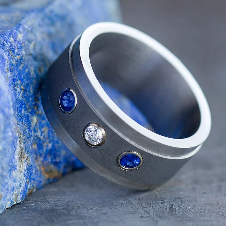 Titanium Ring with Diamond and Blue Sapphires Set in Yellow Gold