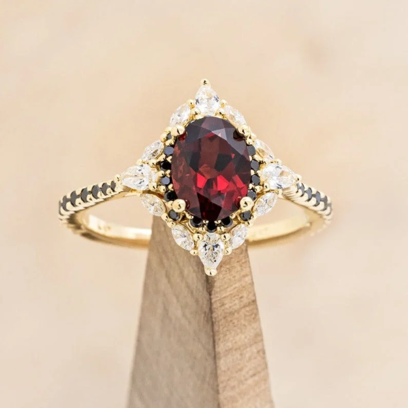 "NORTH STAR" - OVAL GARNET ENGAGEMENT RING WITH BLACK & WHITE DIAMOND HALO & ACCENTS